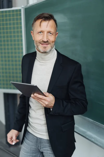 Portrait Confident Middle Aged Teacher Looking Camera While Holding Tablet — Stock Photo, Image