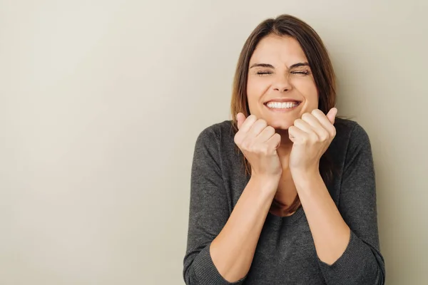 Beaming Young Woman Screwing Her Eyes Holding Her Fists Her — Stock Photo, Image