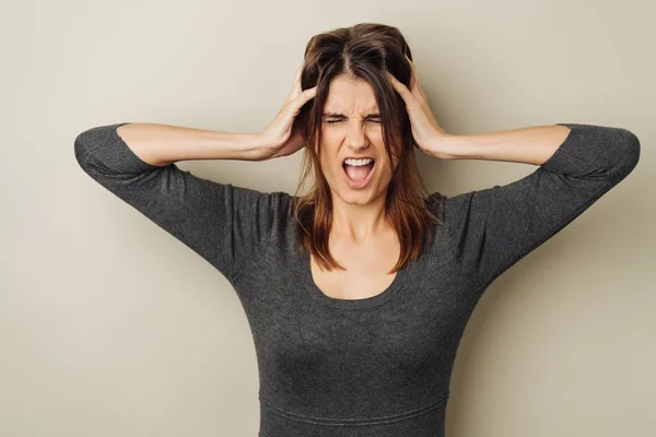 Frustrated Woman Tearing Her Hair Her Hands Yelling Her Anger — Stock Photo, Image