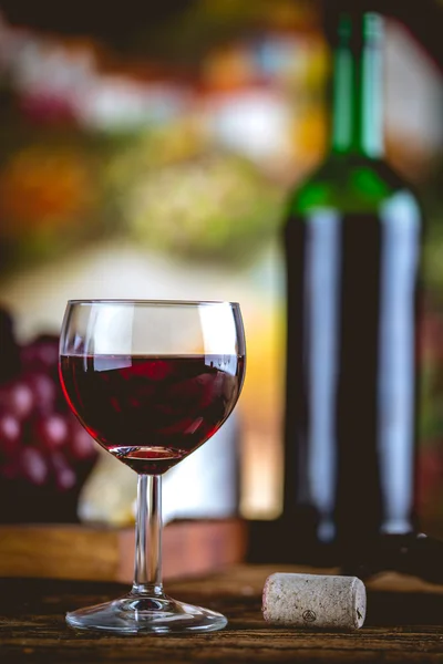 Glass of wine on wooden table, atmospheric composition — Stock Photo, Image