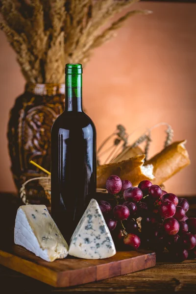 Bottle of wine with cheese, Mediterranean concept — Stock Photo, Image