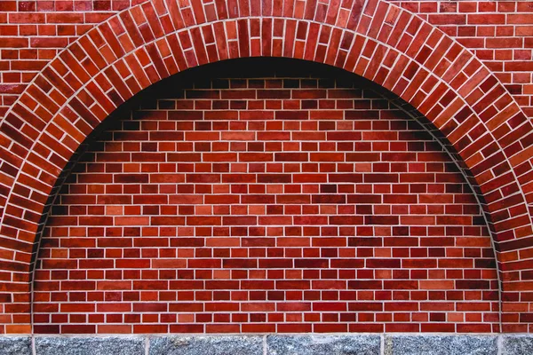 Arco od parede de tijolo vermelho fundo artístico, textura regular — Fotografia de Stock