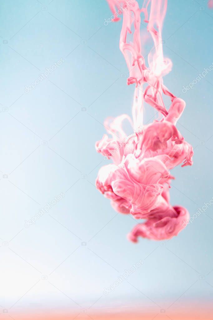 Pink ink in water, artistic shot, abstract background