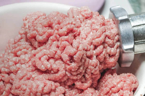 stock image fresh minced meat from meat grinder