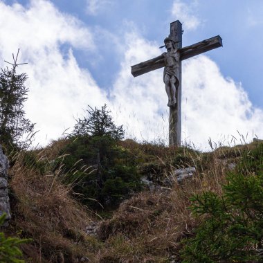 Peak and Summit Cross of Mount Kofel, 1342 m in Ammergauer Alps, Ostalpen, located in Oberammergau, Upper Bavaria, Germany