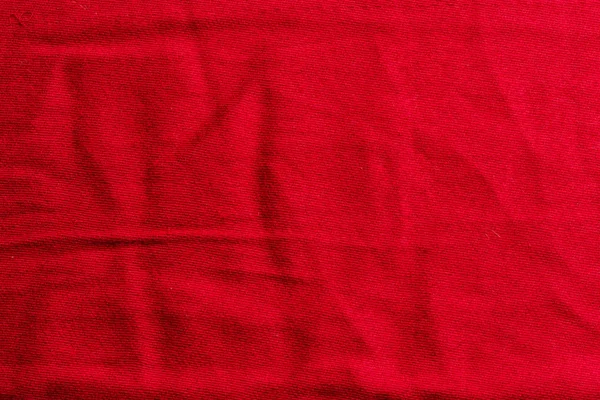 Fondo en forma de tela arrugada de color rojo brillante — Foto de Stock