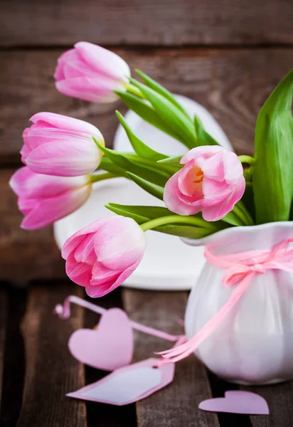 Fresh spring pink tulips with hearts — Stock Photo, Image