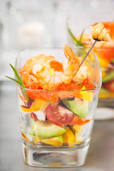 Shrimp, avocado, tomato, salmon and red caviar cocktail salad — Stock Photo, Image