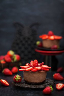 Mini chocolate cheesecake  dessert decorated with fresh strawber clipart