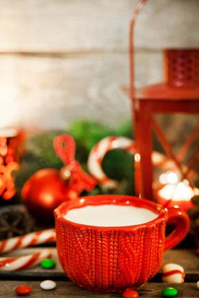 Christmas time red cup of milk and latern with candle light, hol — Stock Photo, Image