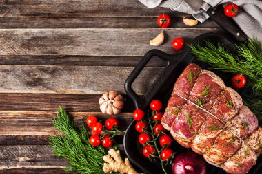 Raw pork meat with spices, ready to cook, on  dark background, t