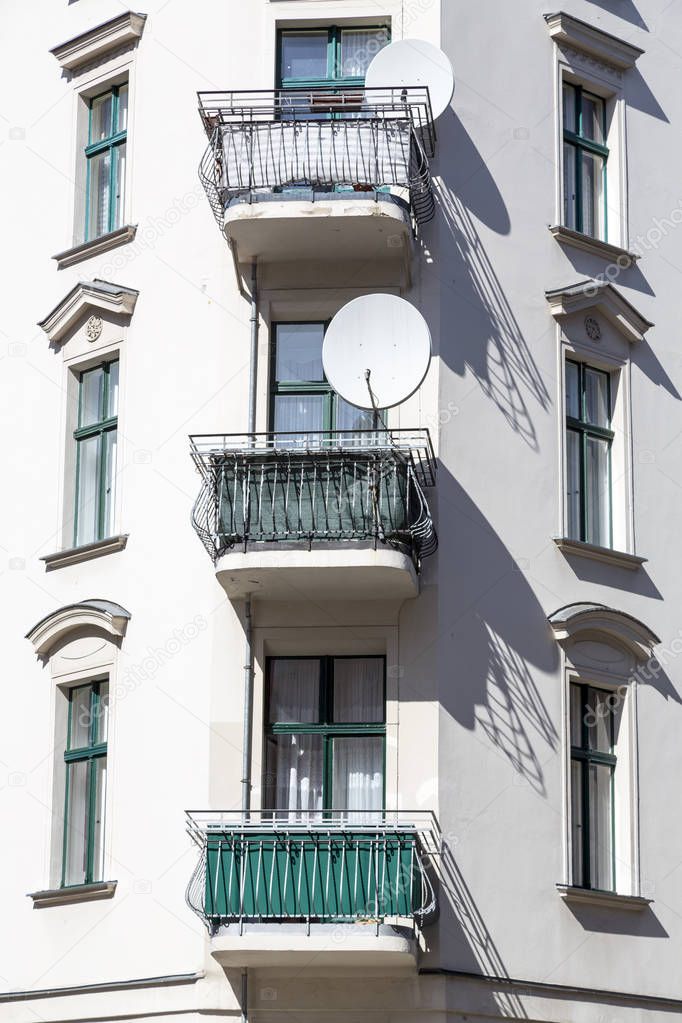old house with balconies and satellite dish in Berlin Kreuzberg