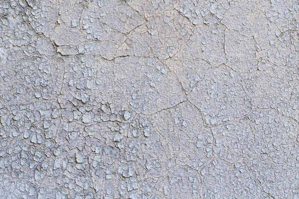 Alte grunzig verputzte Wand mit abblätternder Farbe — Stockfoto
