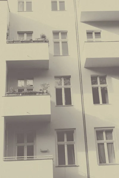 Vintage photo of a house with balconies — Stock Photo, Image