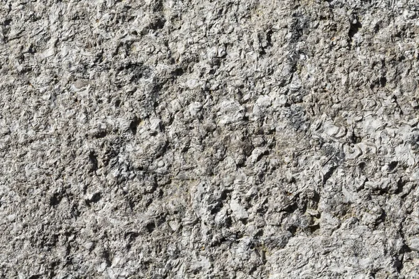 Raue Steinoberfläche einer Wand für Hintergründe — Stockfoto