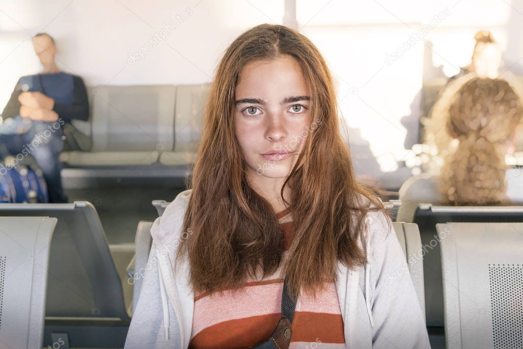 young woman waiting on an airport