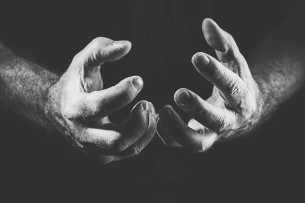 two desperate hands, in black and white