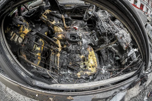 The interior of a burnt out car taken with a fisheye lens — ストック写真