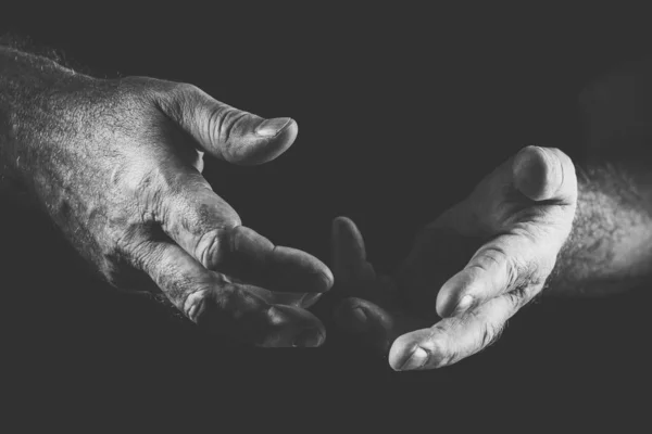 Zwei sprechende Hände, in schwarz und weiß Stockbild