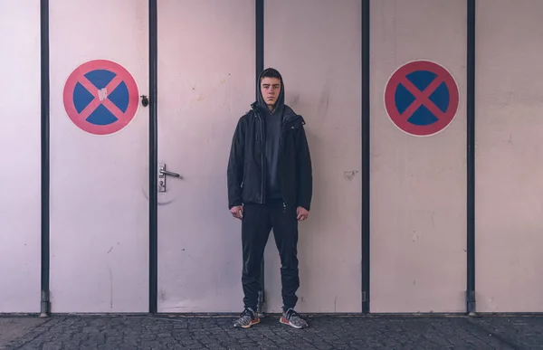 Young Man Stands Two Parking Traffic Signs — Stock Photo, Image