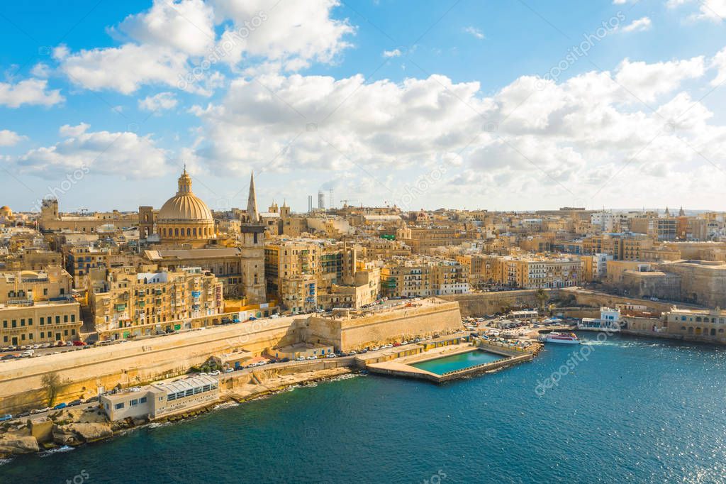 Aerial panorama view of  Valletta city - capital of Malta country. Mediterranean sea. Blue sky with clouds