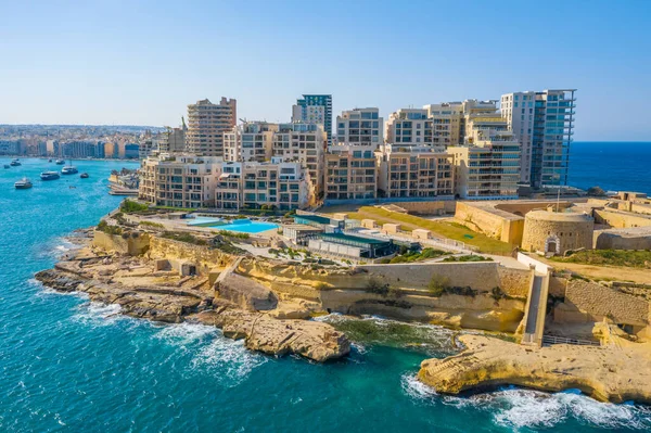 Aerial top view of Tigne Point apartment complex in Sliema city. Malta country. Sunny day, blue sky, Mediterranean sea