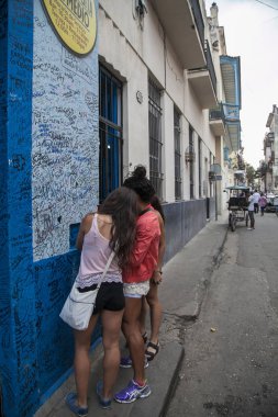  Havana, Cuba - 21 January 2013: A view of the streets of the city with cuban people. clipart