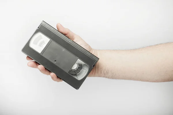 Mannelijke hand houdt Vhs, video tape — Stockfoto