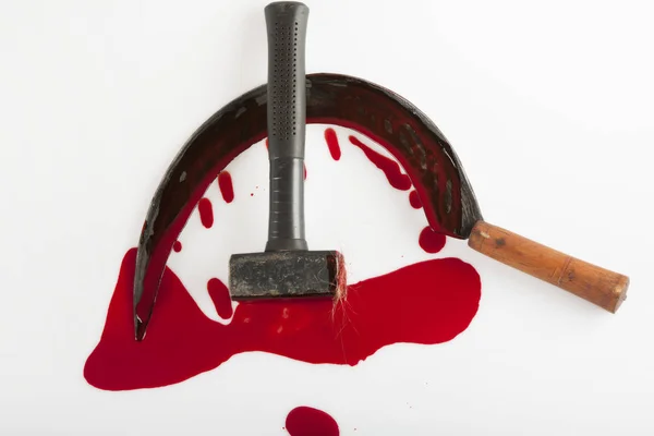 Hammer and sickle smeared with blood — Stock Photo, Image