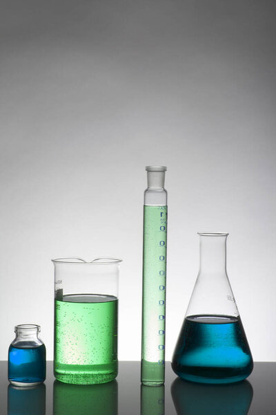 Liquid in laboratory bottles. Scientific biochemical laboratory. Colorful liquid.