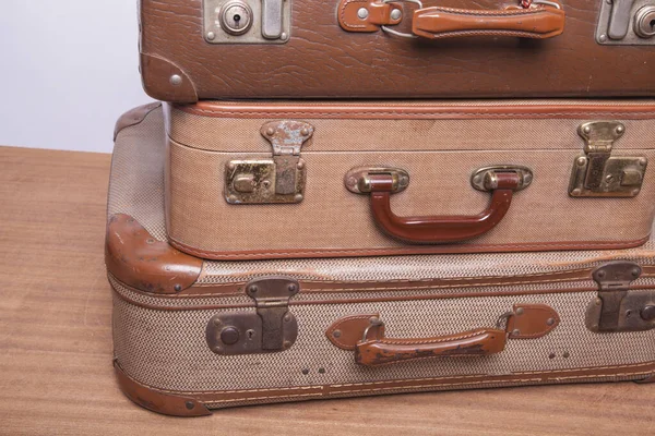 Old, retro, suitcases lie on the table with white background — Stock Photo, Image