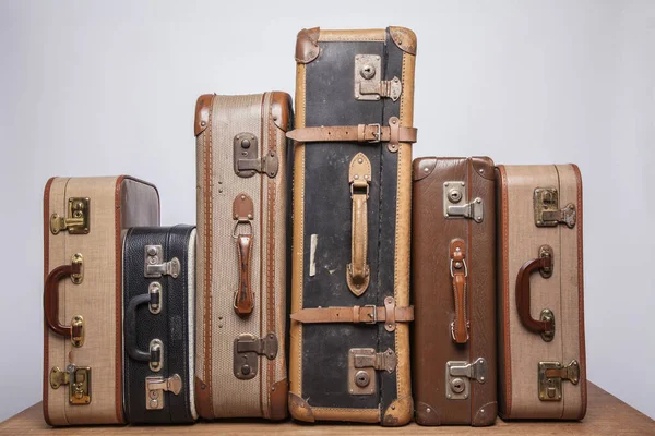 Old, retro, suitcases lie on the table with white background — ストック写真