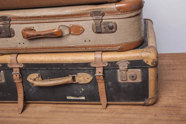 Old, retro, suitcases lie on the table with white background — Stock Photo, Image