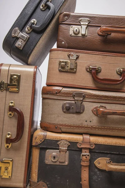 Old, retro, suitcases lie on the table with white background — ストック写真
