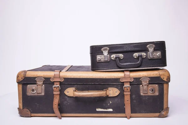 Old, retro, suitcases lie on the table with white background — ストック写真