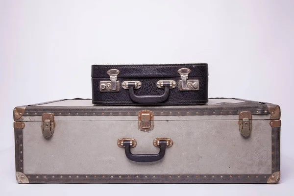 Old, retro, suitcases lie on the table with white background — ストック写真