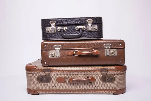 Old, retro, suitcases lie on the table with white background — ストック写真