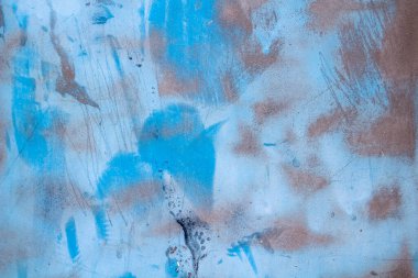 Beton bir duvardaki mavi boyanın rengi ve dokusu