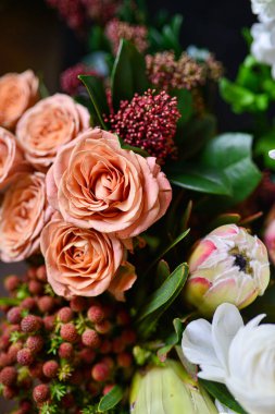 Rose cappuccino, brunia, daffodil, Eustoma, lisianthus, ranunculus, Skimia the most beautiful bouquet of flowers this year