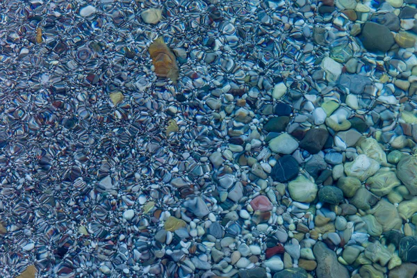 Sea stones under clear water