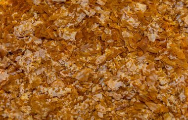 Shellac pulları, Shellac dişi lakin tarafından salgılanan bir reçine.