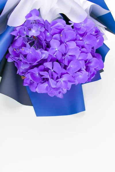 Violet bouquet of flowers on a white background. Bottom part. Place for an inscription. Easy to cut. View from above. close-up. The concept of floristry.