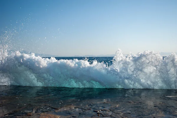 Waves hit the hard surface of concrete slabs