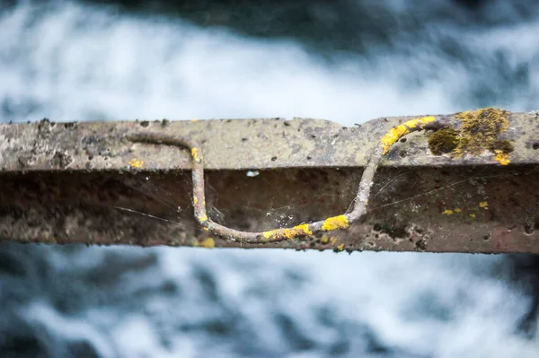 Iron rail over water rust from old age — Stock Photo, Image