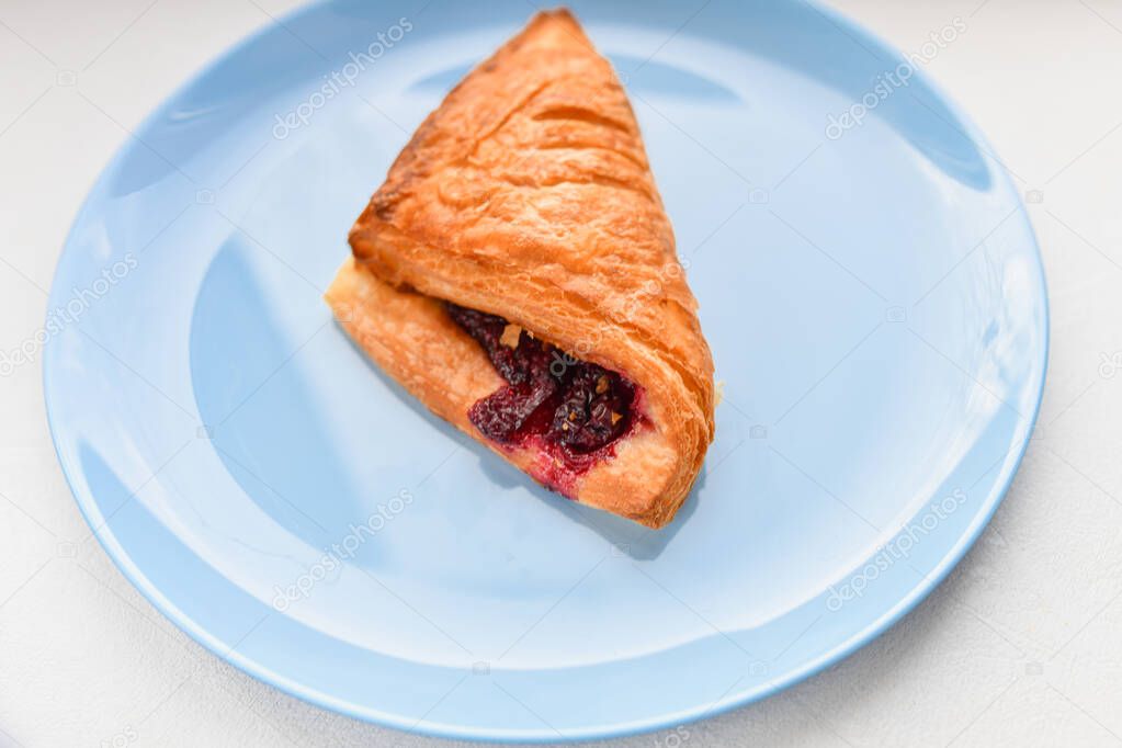 homemade berry croissant. Fresh Croissant On A Wooden Background 