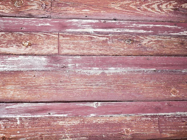 Vecchia parete rossa in legno. Una vecchia superficie dipinta in legno per il design e la creatività. Texture di una vecchia tavola rossa dipinta in legno per creatività e sfondi — Foto Stock