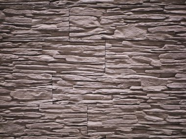Taş cephe, yakın plan. Yırtık taş dokusu. Taş duvar