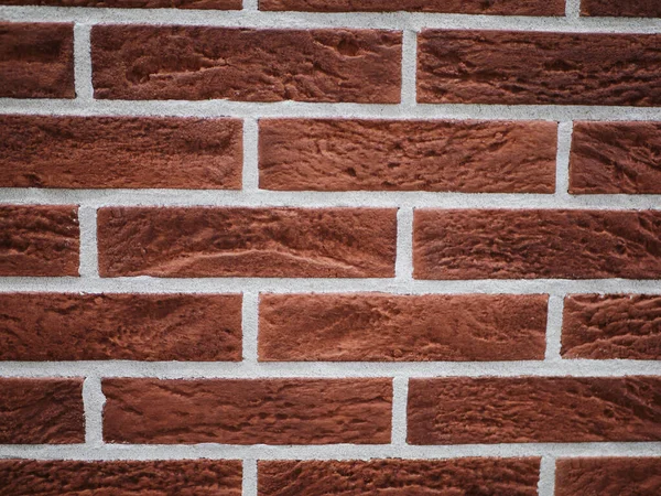 Facciata in mattoni arancioni. Struttura in pietra strappata. Muro di pietra. sfondo astratto — Foto Stock