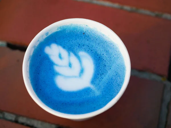 Matcha blue tea. Matcha blue tea. Side view of matcha blue tea. Drinking in a place.