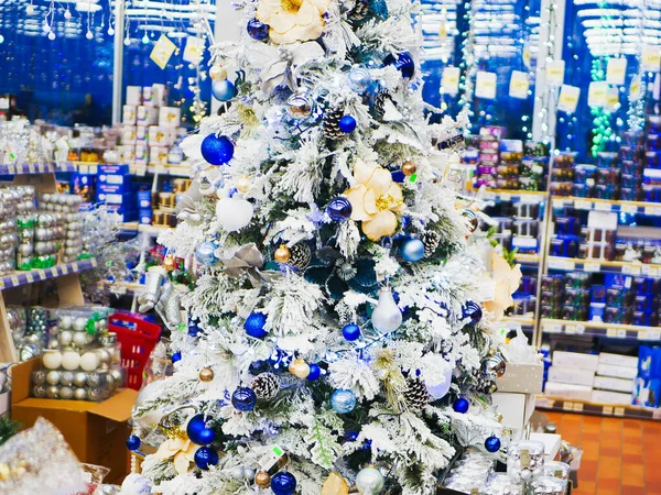 White decorated Christmas tree. White decorated Christmas trees with many gifts in delicate pastel colors. Good New Year spirit. White decorated Christmas tree with many gifts.